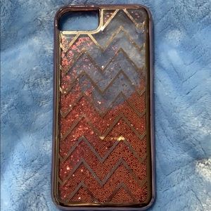 Pink, hard plastic, moving gems and glitter inside